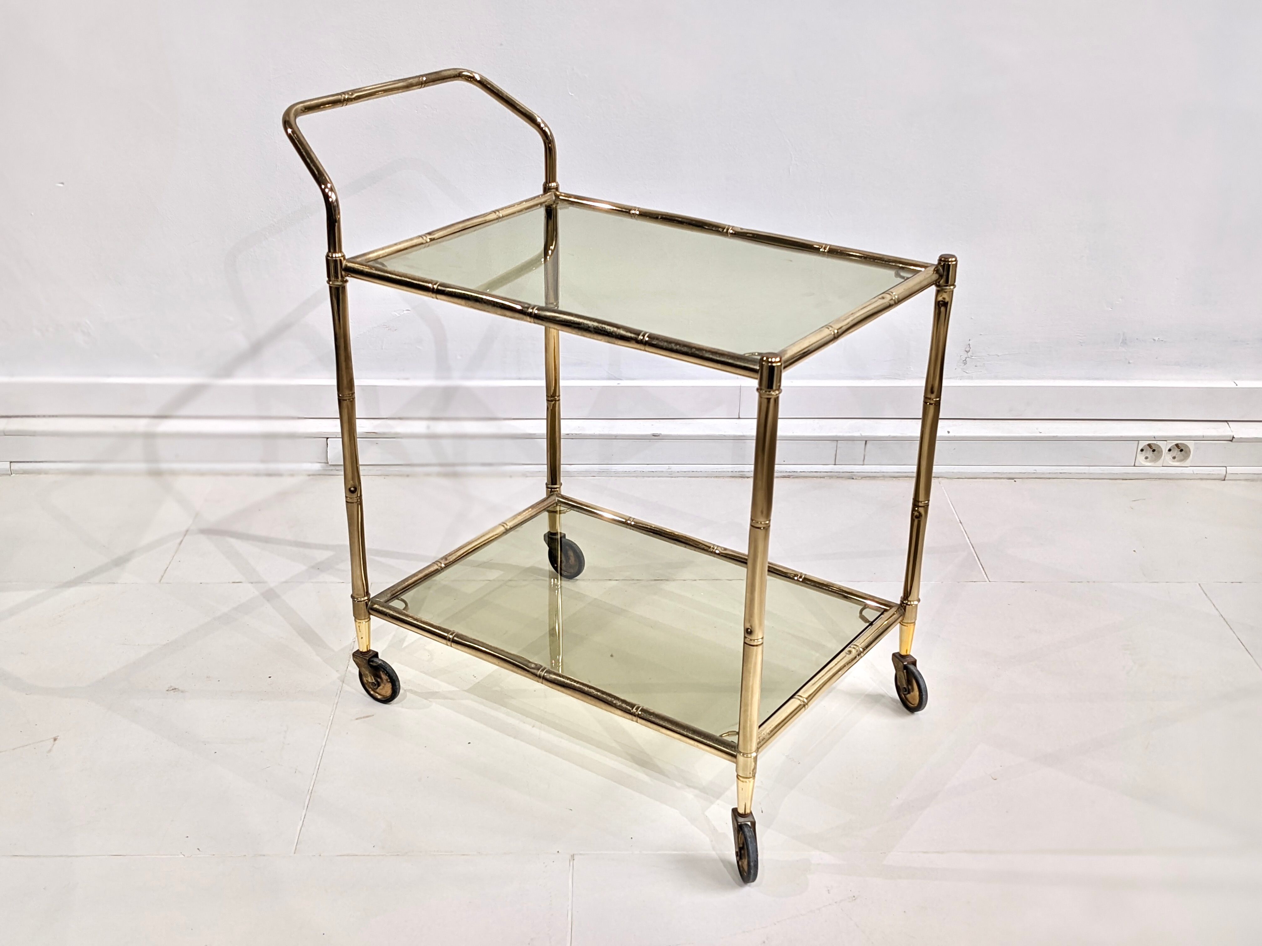 Golden metal dessert with tinted glass tops