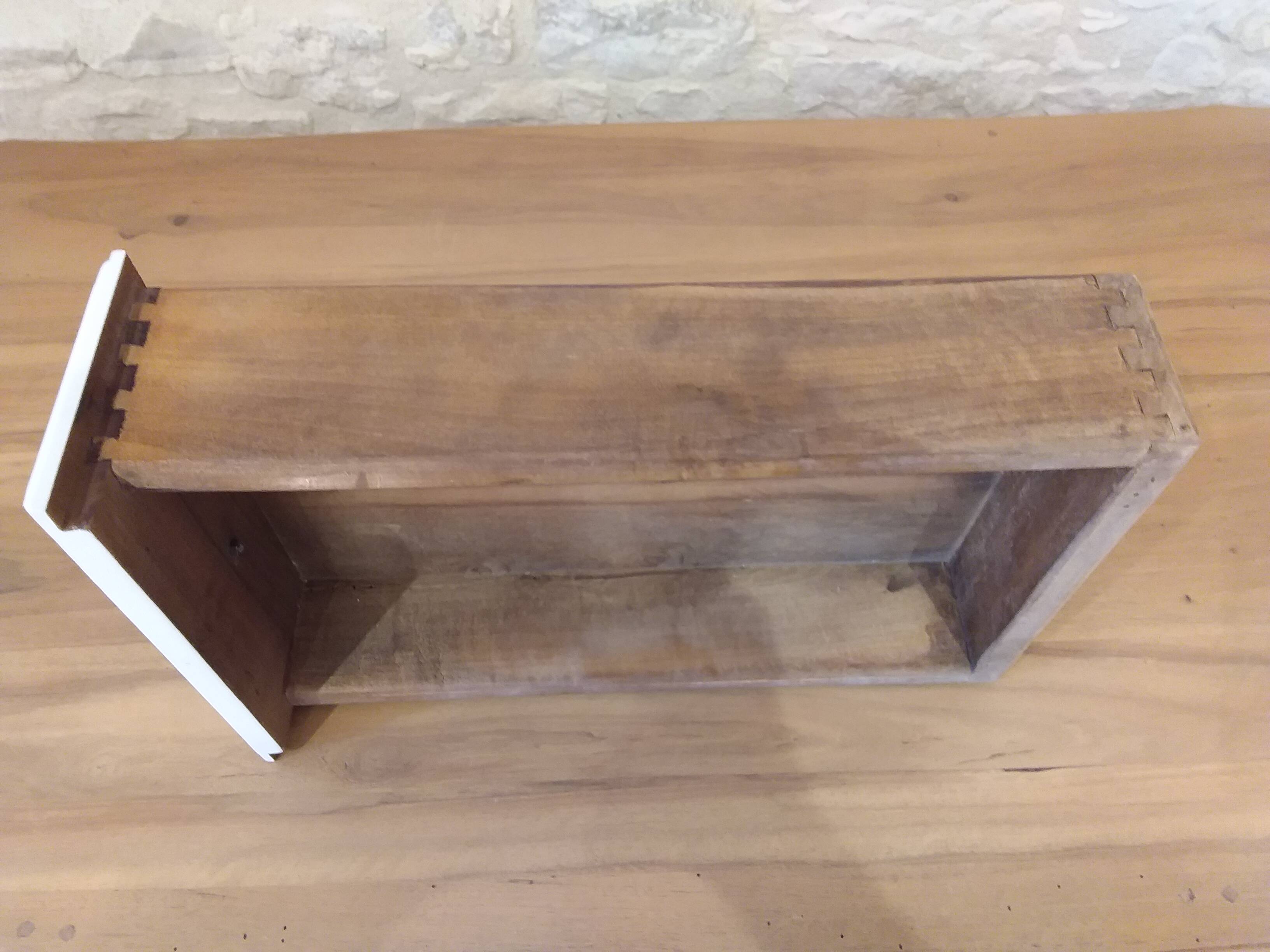 Solid wood desk with distressed white paint.