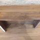 Solid wood desk with distressed white paint.