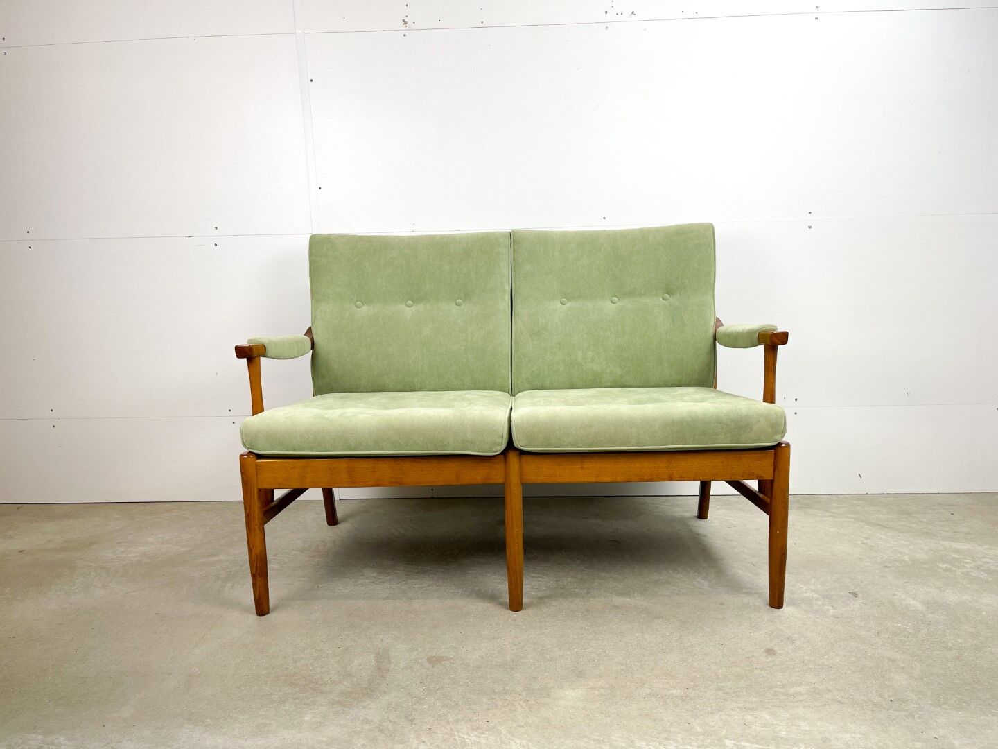 Two-seater sofa from the sixties with green upholstery