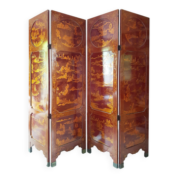 Four-panel Japanese-style screen in red and gold lacquer.