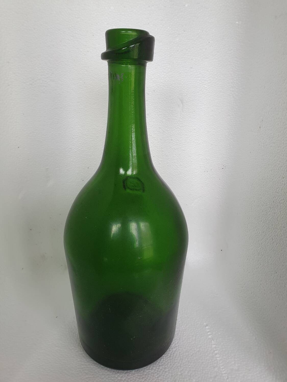 Old thick green glass bottle