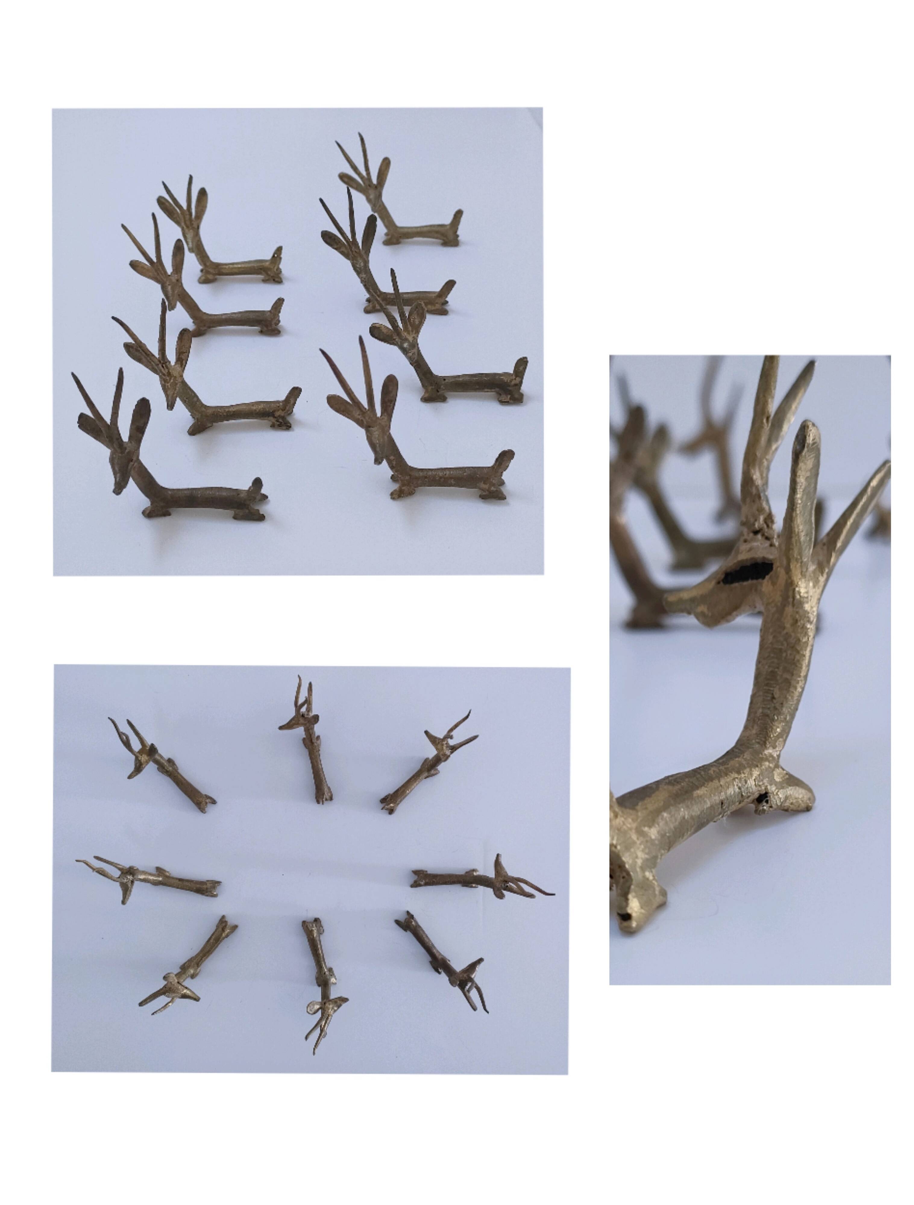 eight vintage brass Gazelle knife rests