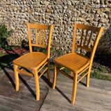 Pair of honey-colored luterma bistro chairs