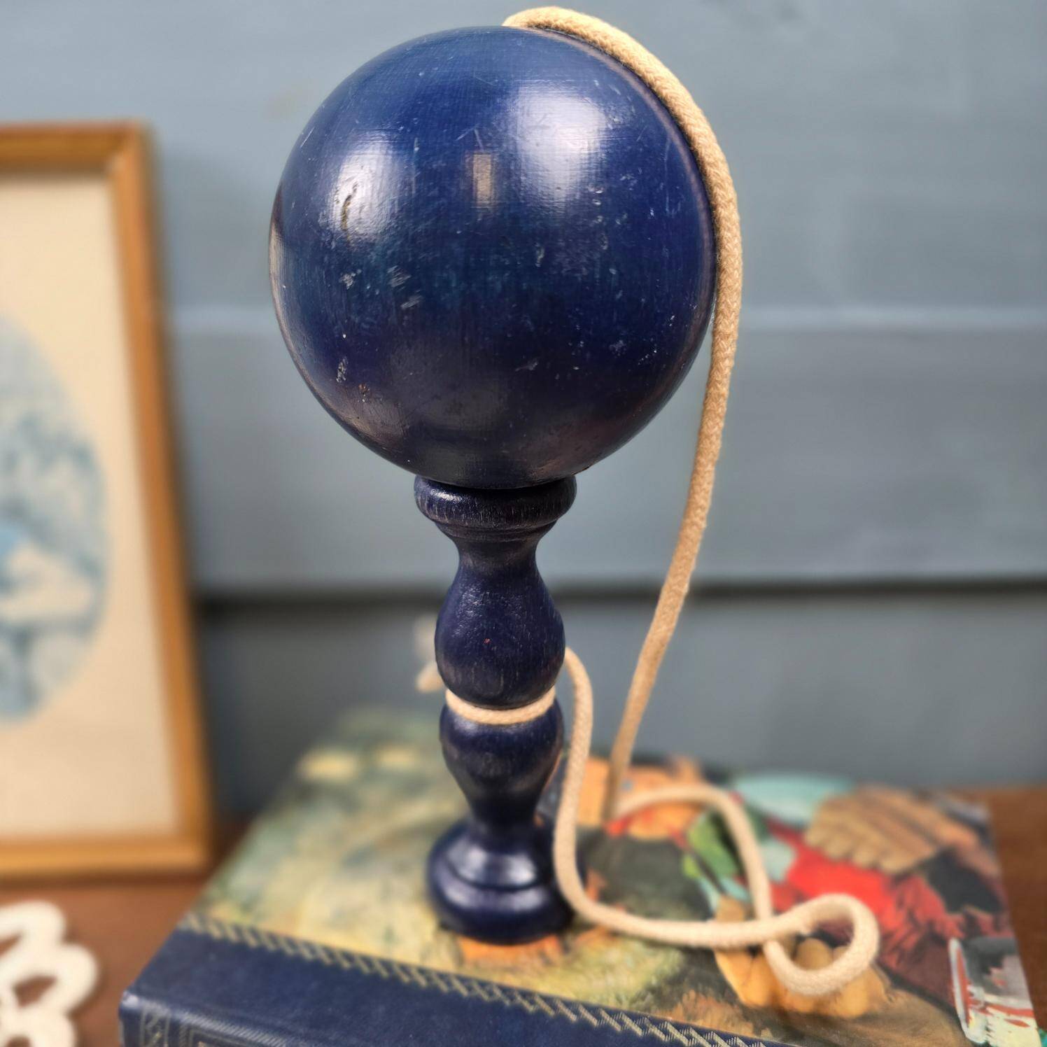 Antique navy blue wooden cup-and-ball toy – Vintage skill toy