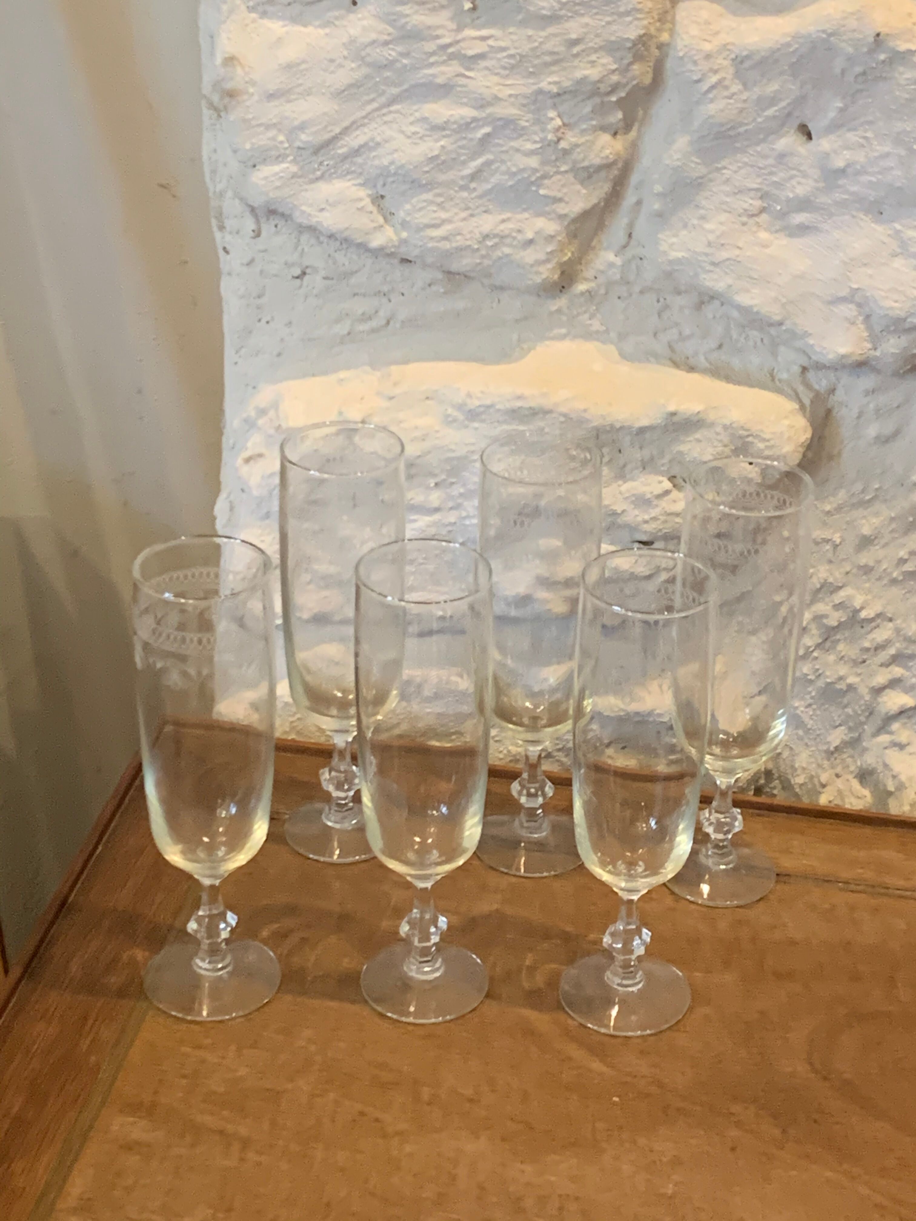 6 chiseled champagne flutes on vintage floral frieze pattern