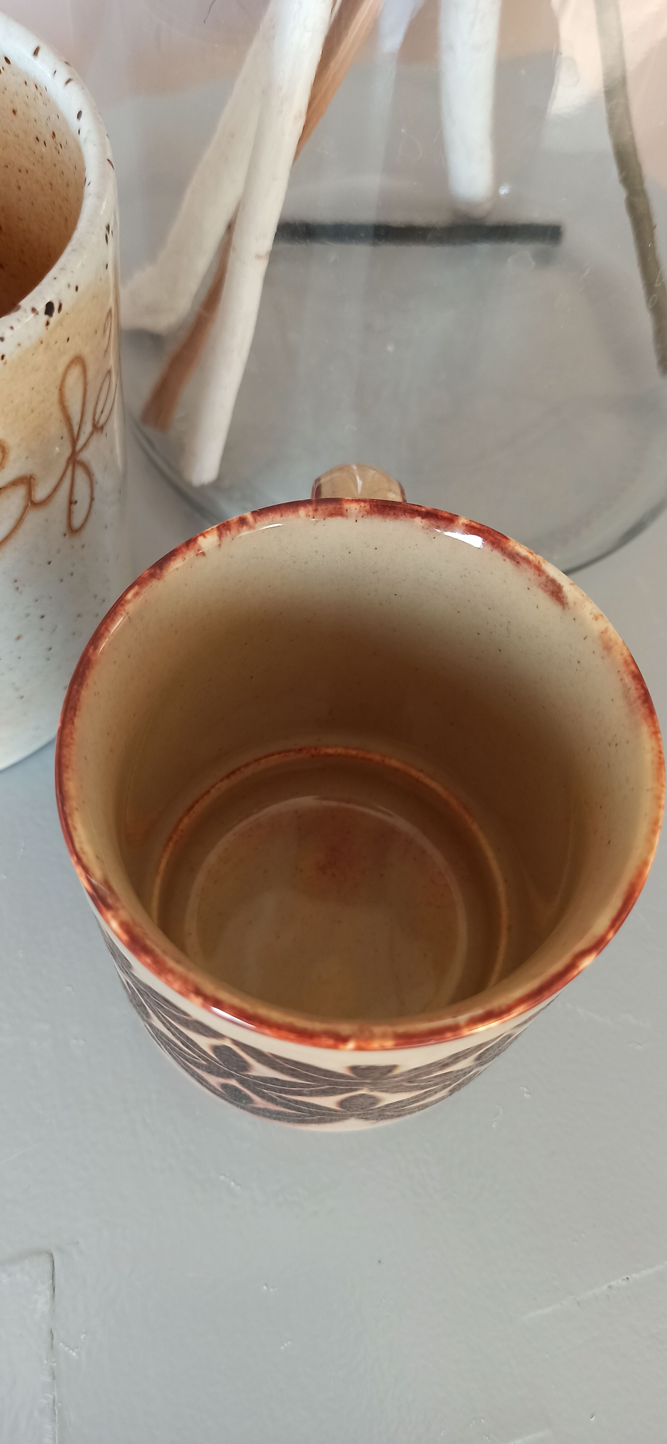 Coffee pot and mug cup in sandstone