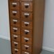 German Oak Apothecary Cabinet with Enamel Shields, 1940s