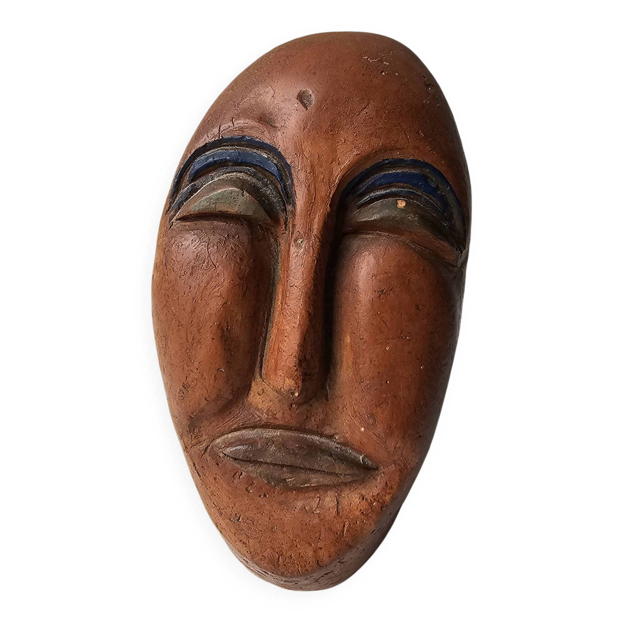 Terracotta face sculpture in African art style