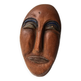 Terracotta face sculpture in African art style