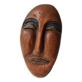 Terracotta face sculpture in African art style