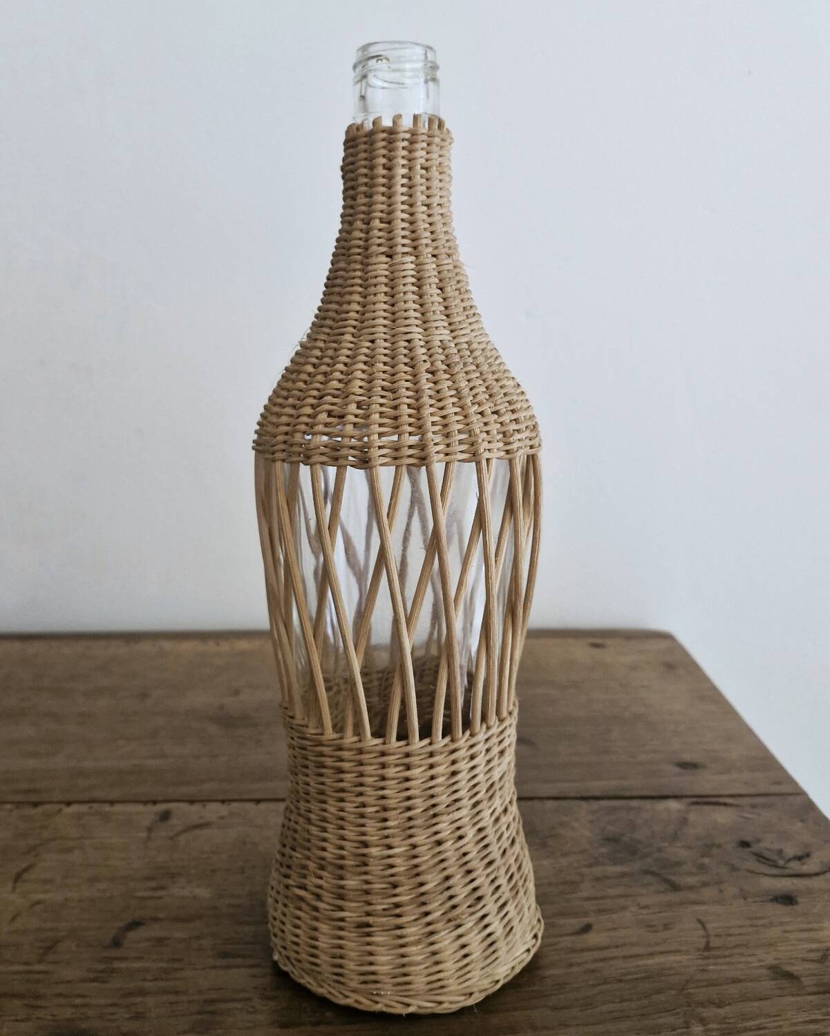 Glass and wicker bottle