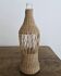 Glass and wicker bottle