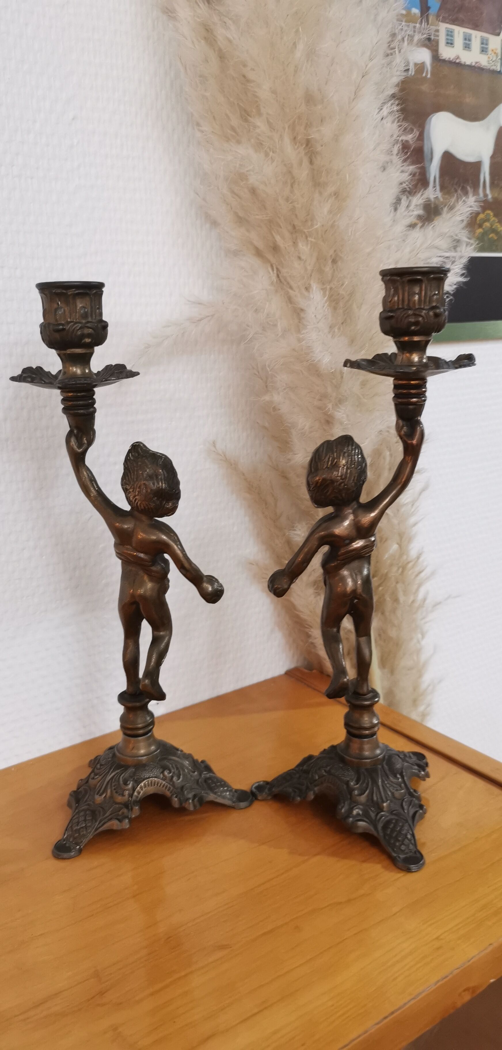 Pair of antique candlesticks in bronze and brass