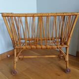 Rattan wicker cradle on wooden wheels