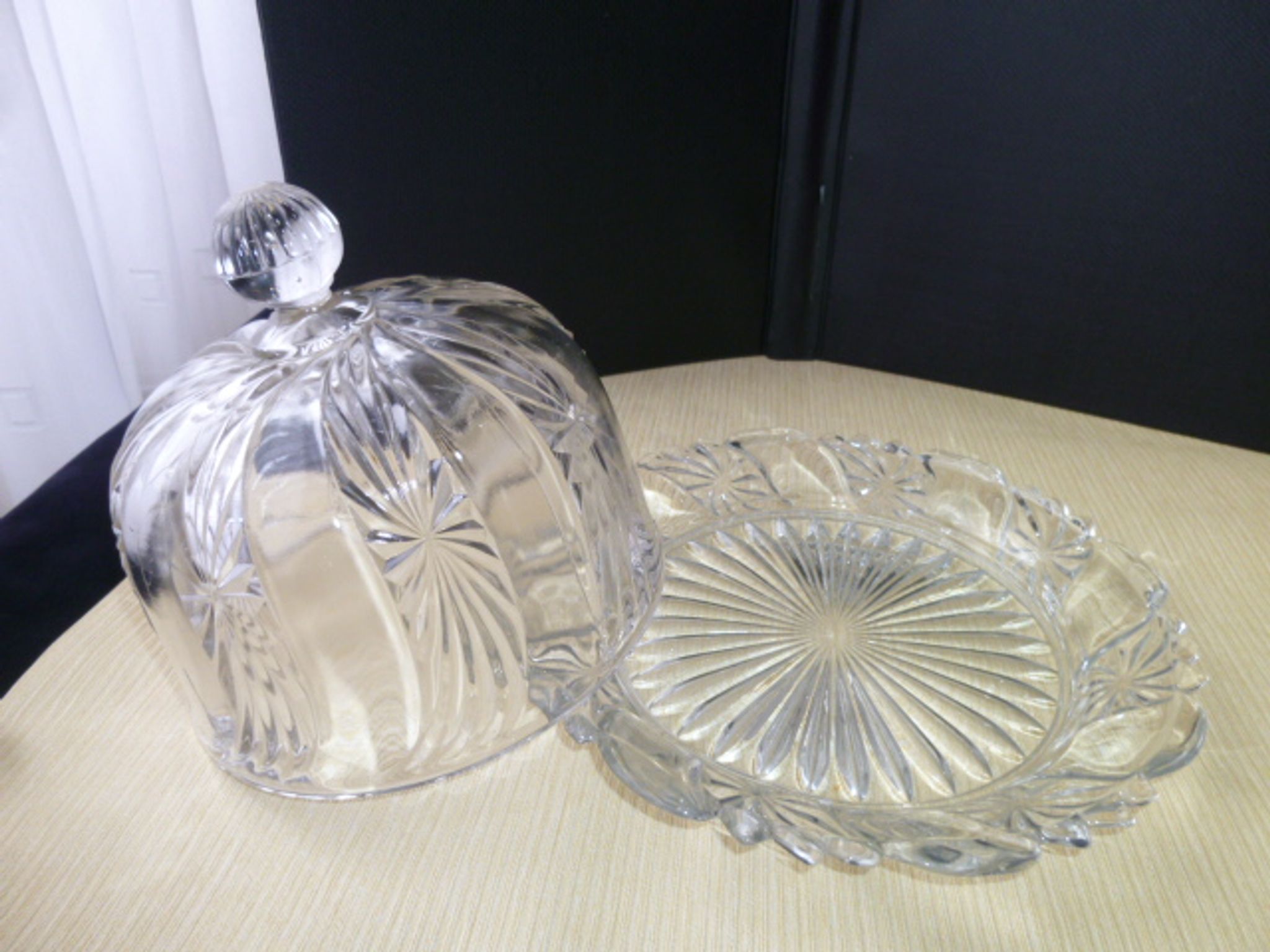 Old cheese bell on its molded pressed glass tray