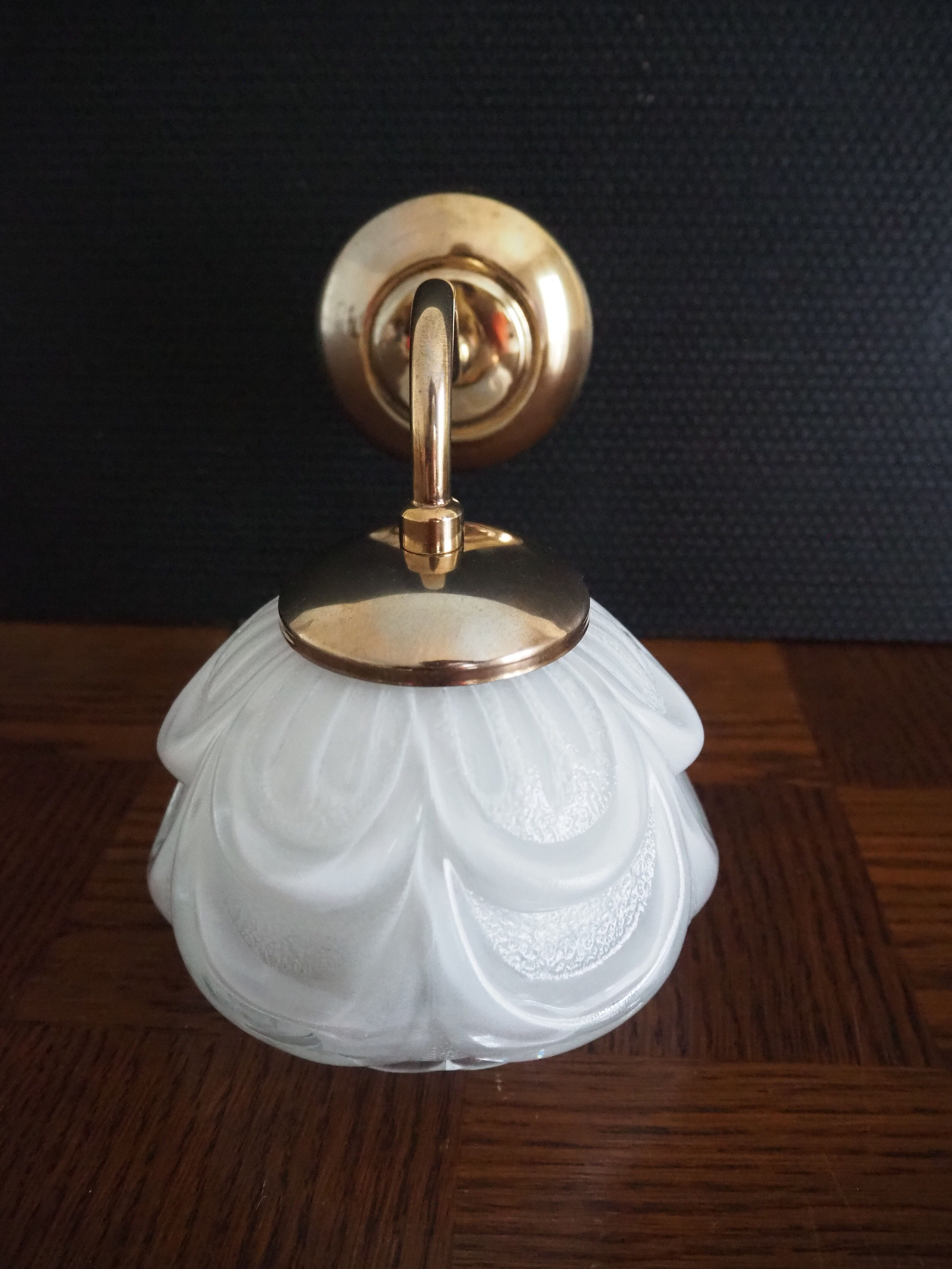 Brass wall lamp and white glass globe from the 1950s-1960s.
