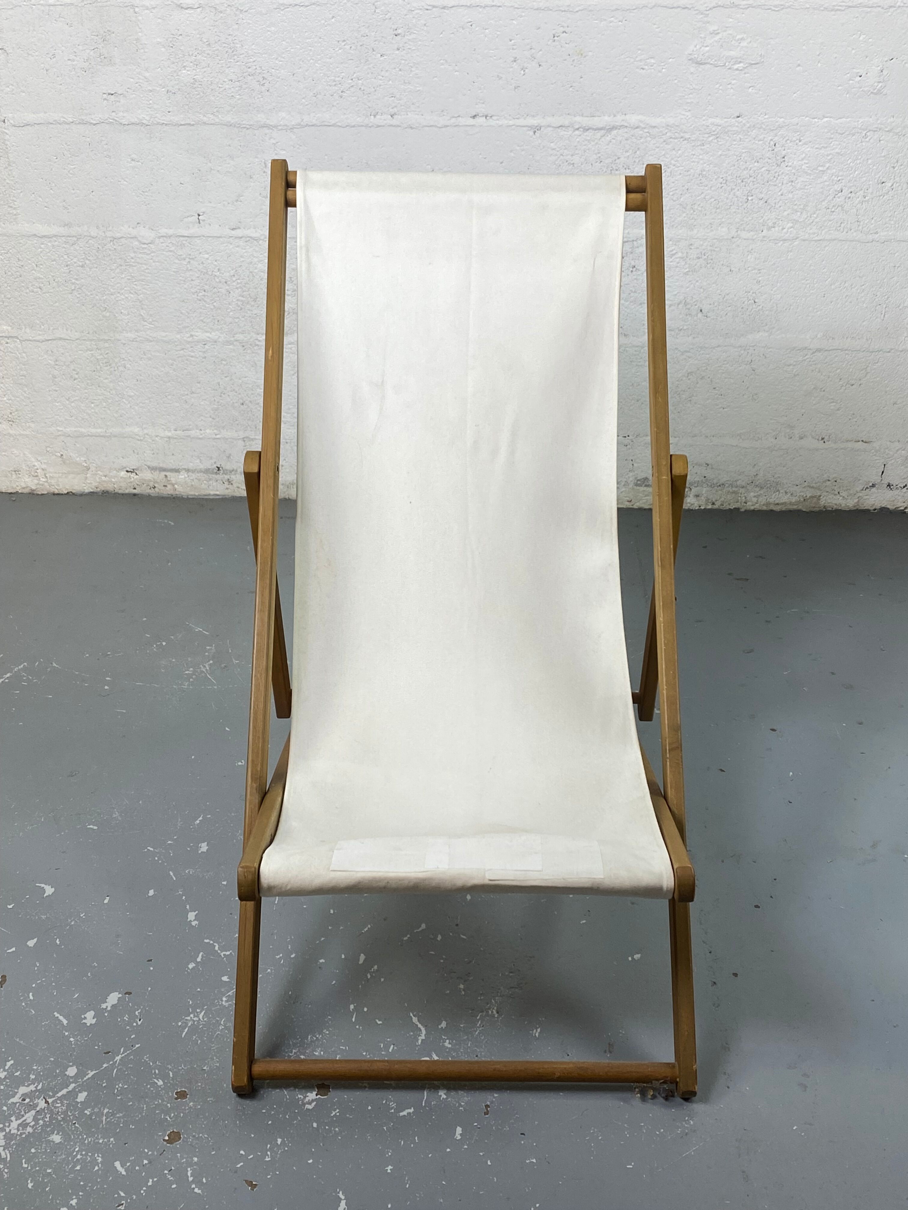 White fabric deckchair with wooden structure