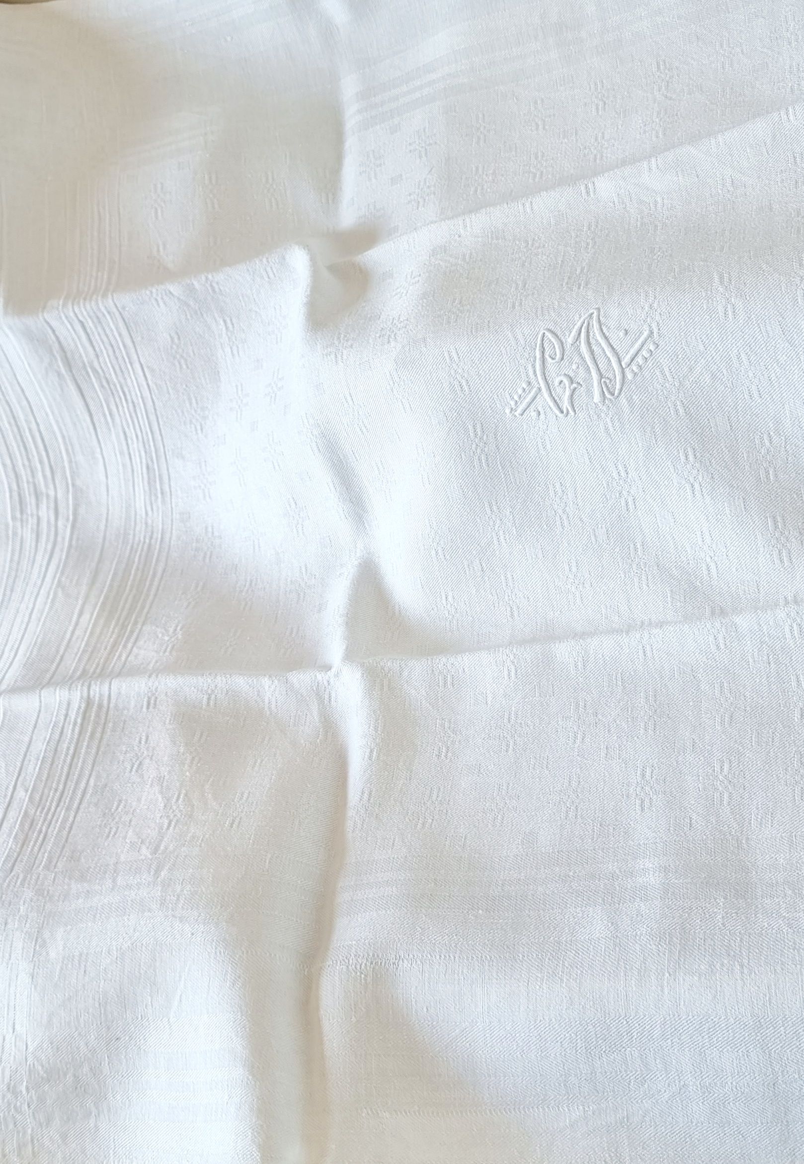 12 antique French linen towels with damask embroidery with "GB" anagrams.