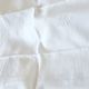 12 antique French linen towels with damask embroidery with "GB" anagrams.
