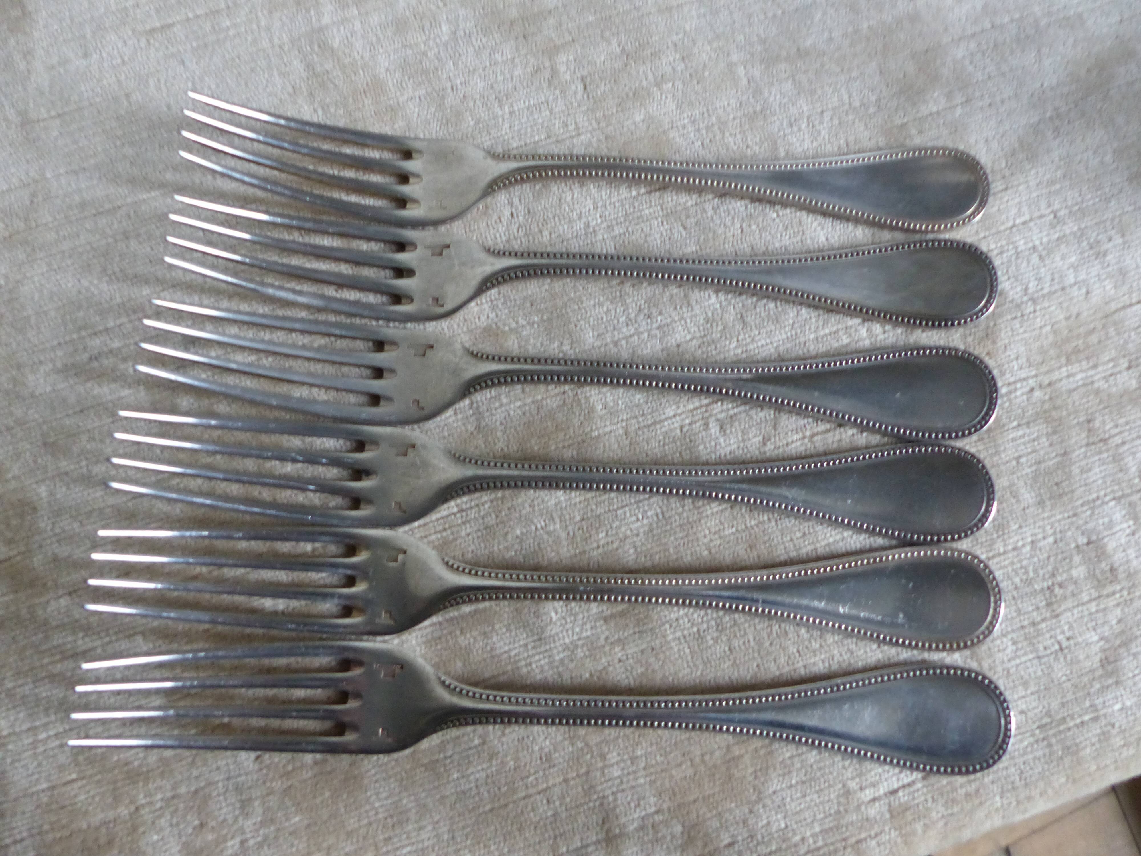 Six spoons, six forks, a ladle Christofle beaded style