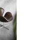 Brown leather Swan chair by Arne Jacobsen, mid-century Danish modernity.
