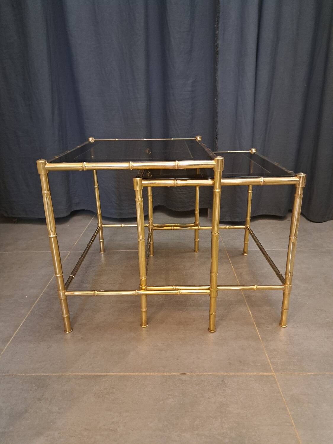Nesting bamboo tables with gold-plated brass trim