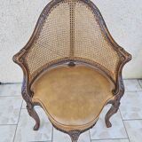 Fauteuil de bureau louis xv, sculpté, canné, garni cuir