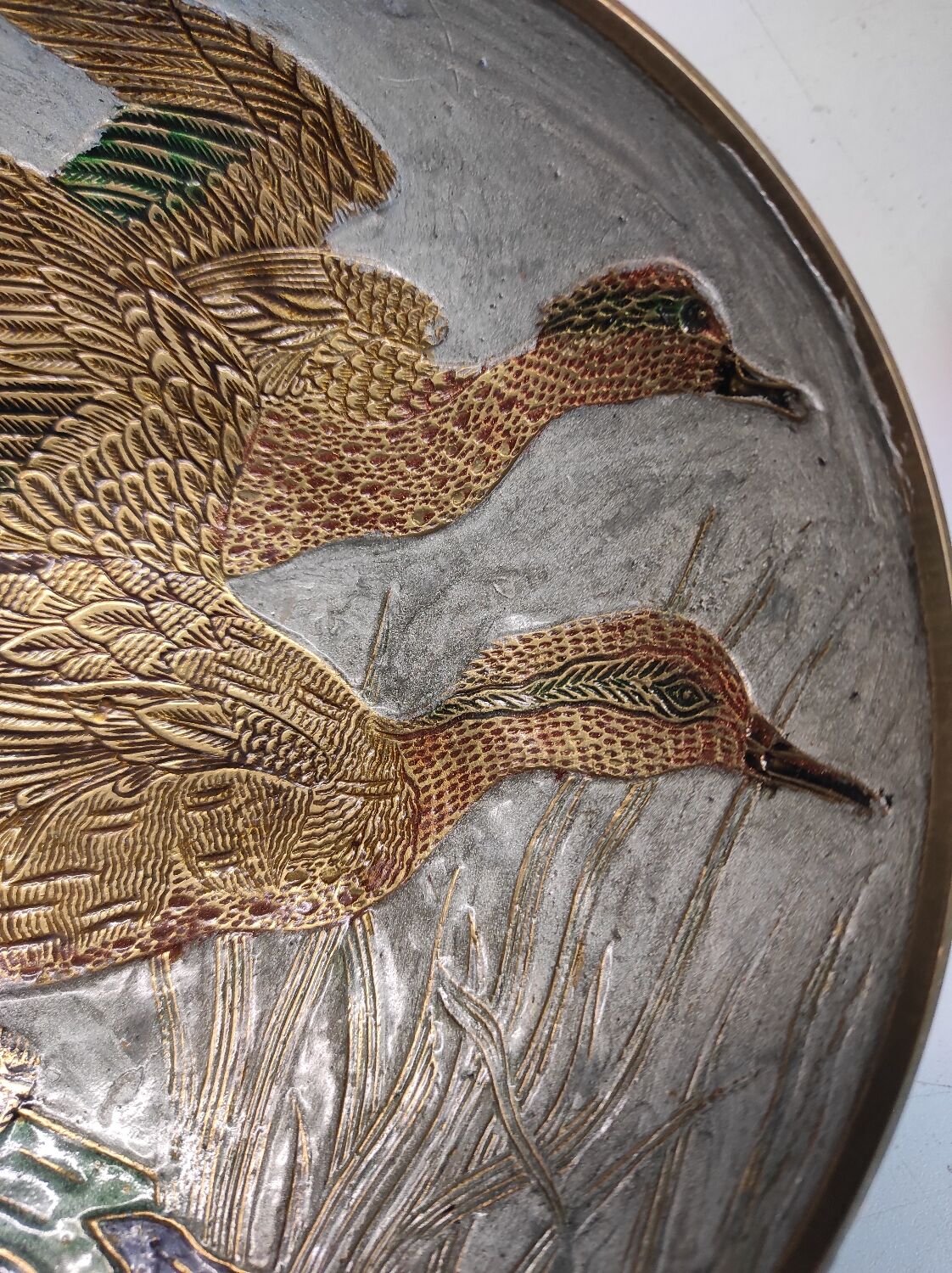 Empty enamelled pocket and brass