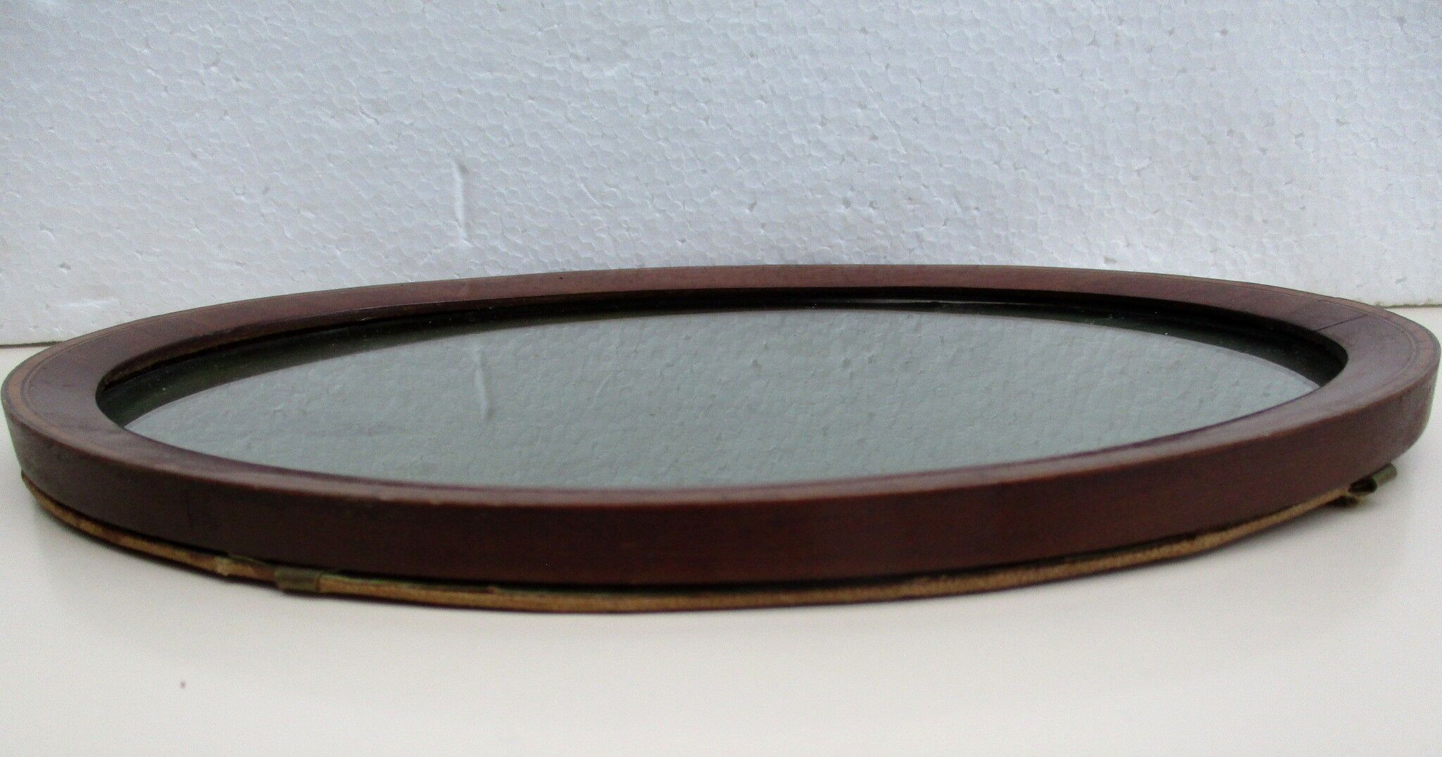 Oval wall frame in wood marquetry