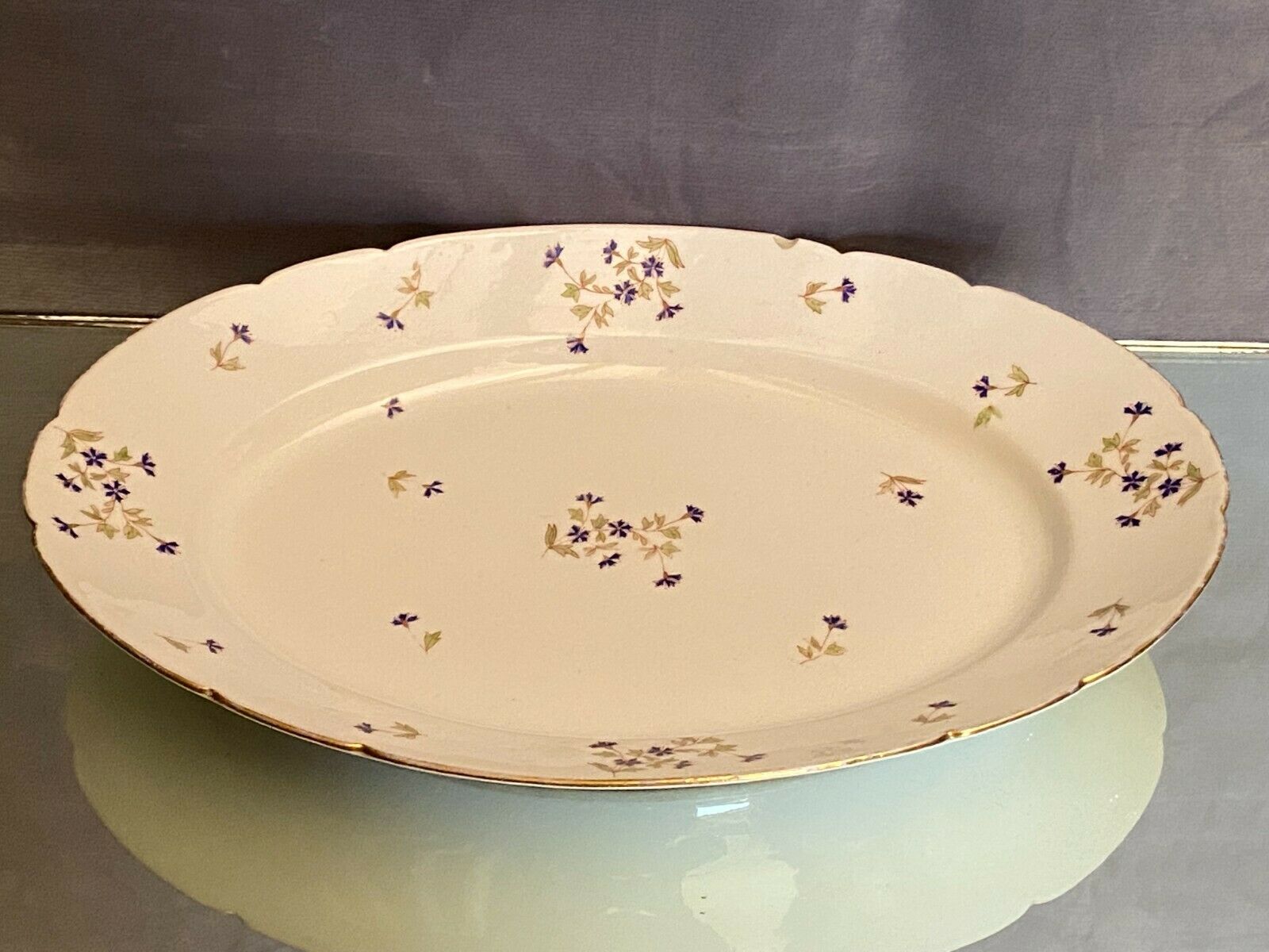 Oval-shaped dish in Limoges porcelain decoration with Louis XV style barbels