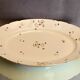 Oval-shaped dish in Limoges porcelain decoration with Louis XV style barbels
