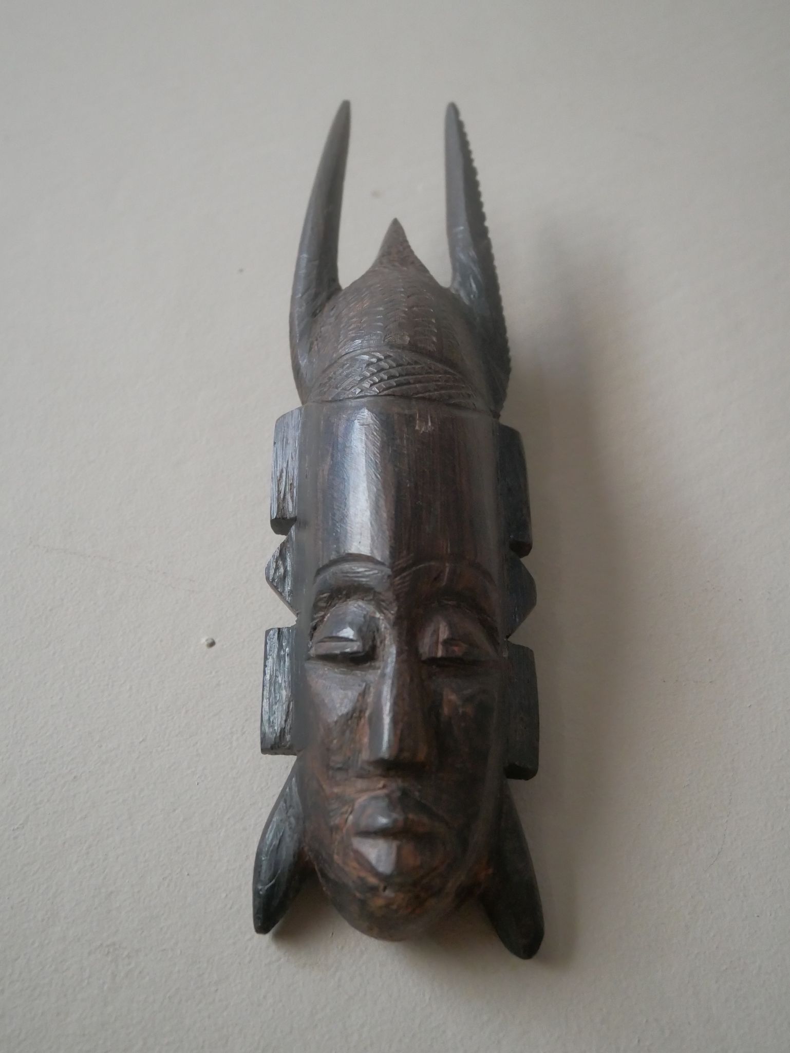 Carved wooden mask, vintage tribal decoration object, African art