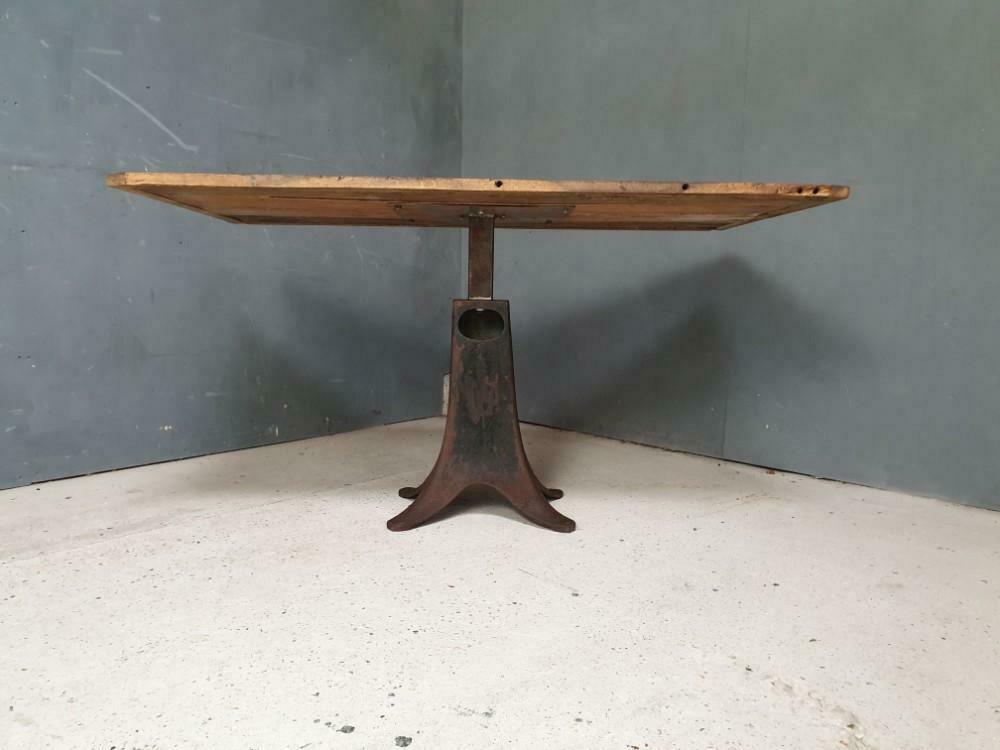 Old table on cast iron machine leg