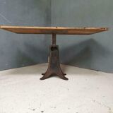 Old table on cast iron machine leg