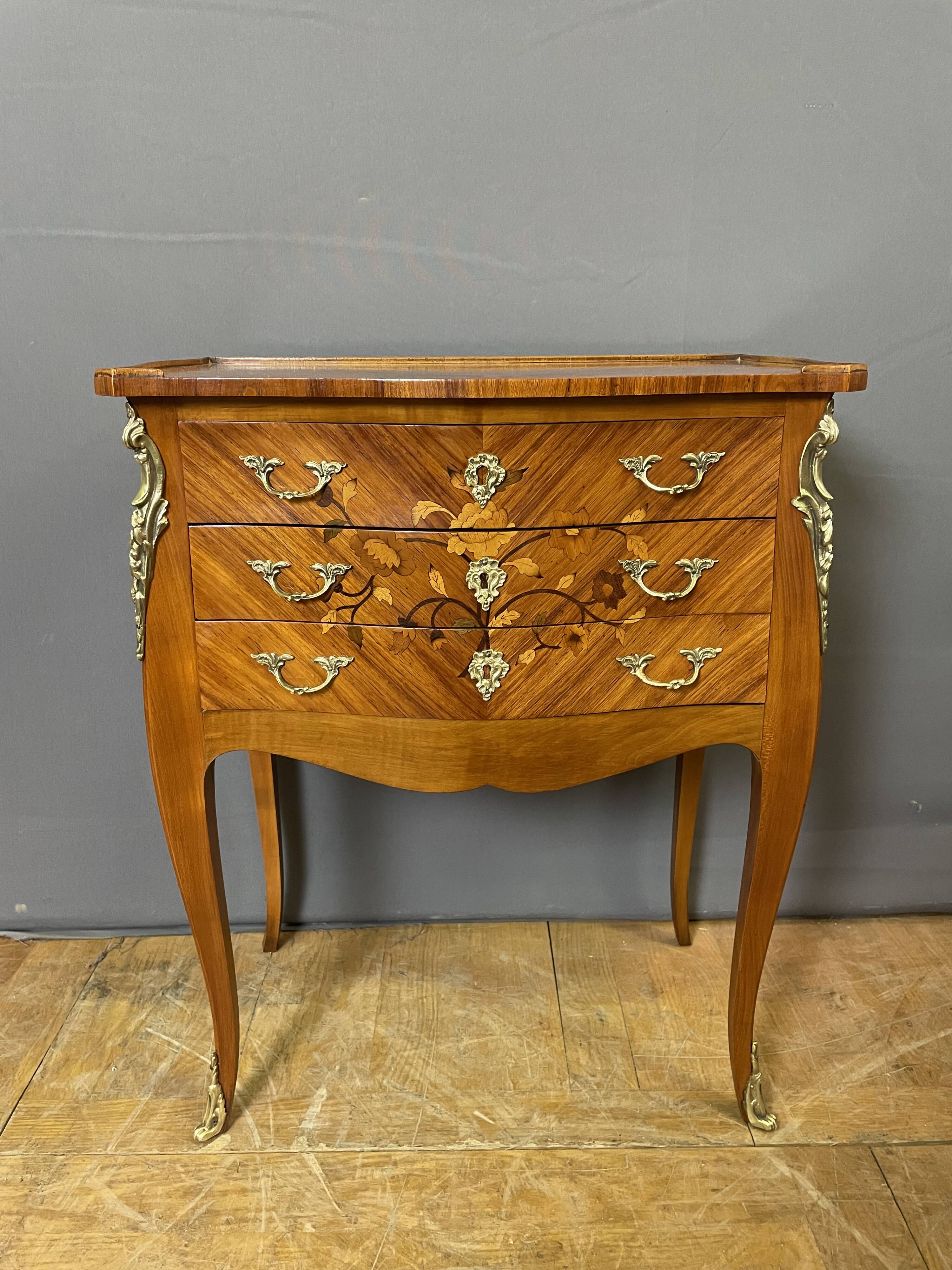 Pair of Louis XV style bedside tables in rosewood marquetry.