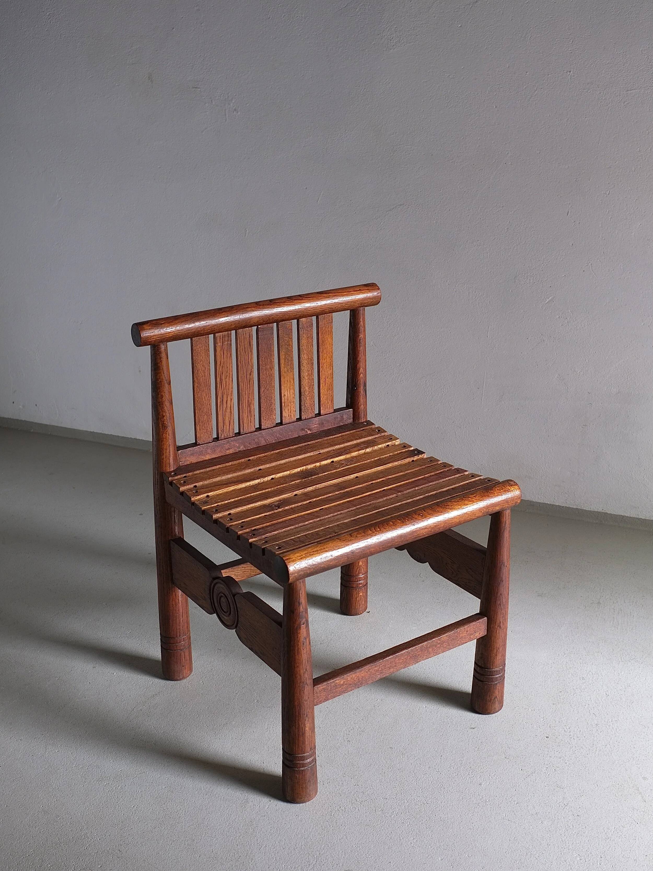 Carved oak low back chair | France | 1960s