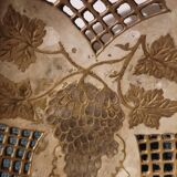 Empty pocket in openwork copper, chiseled and painted vine branches