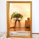 Vintage rectangular gilt mirror, molded wooden frame with beads and fire