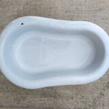 Antique bidet in enamelled sheet metal with wrought iron support