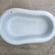 Antique bidet in enamelled sheet metal with wrought iron support