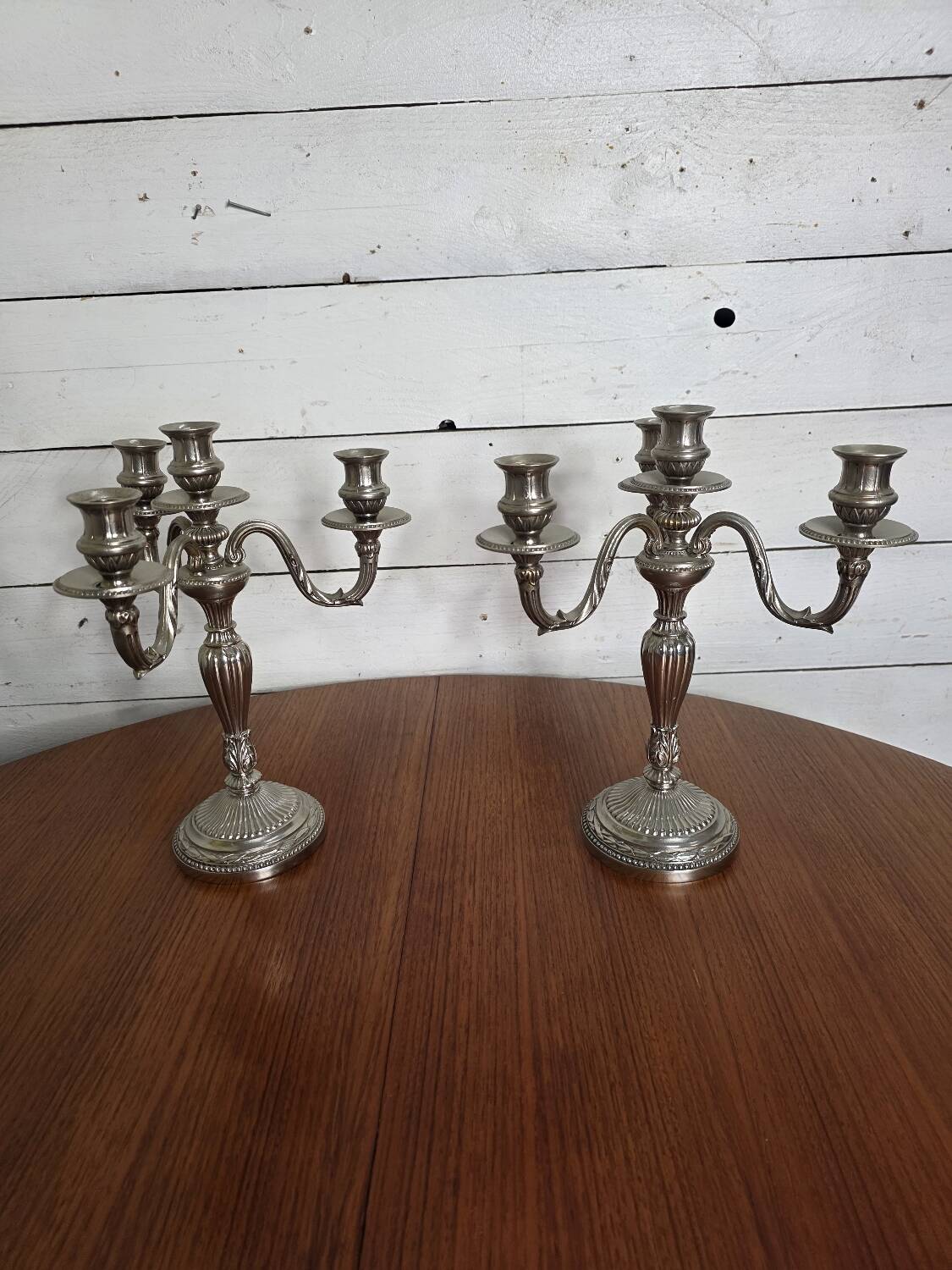 Pair of Louis XVI style candlesticks in silver-plated bronze