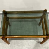 Blonde wood coffee table with smoked glass and leather bindings.