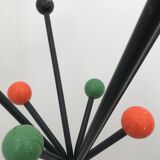 Wearing chrome parrot coat, black and multicolored balls