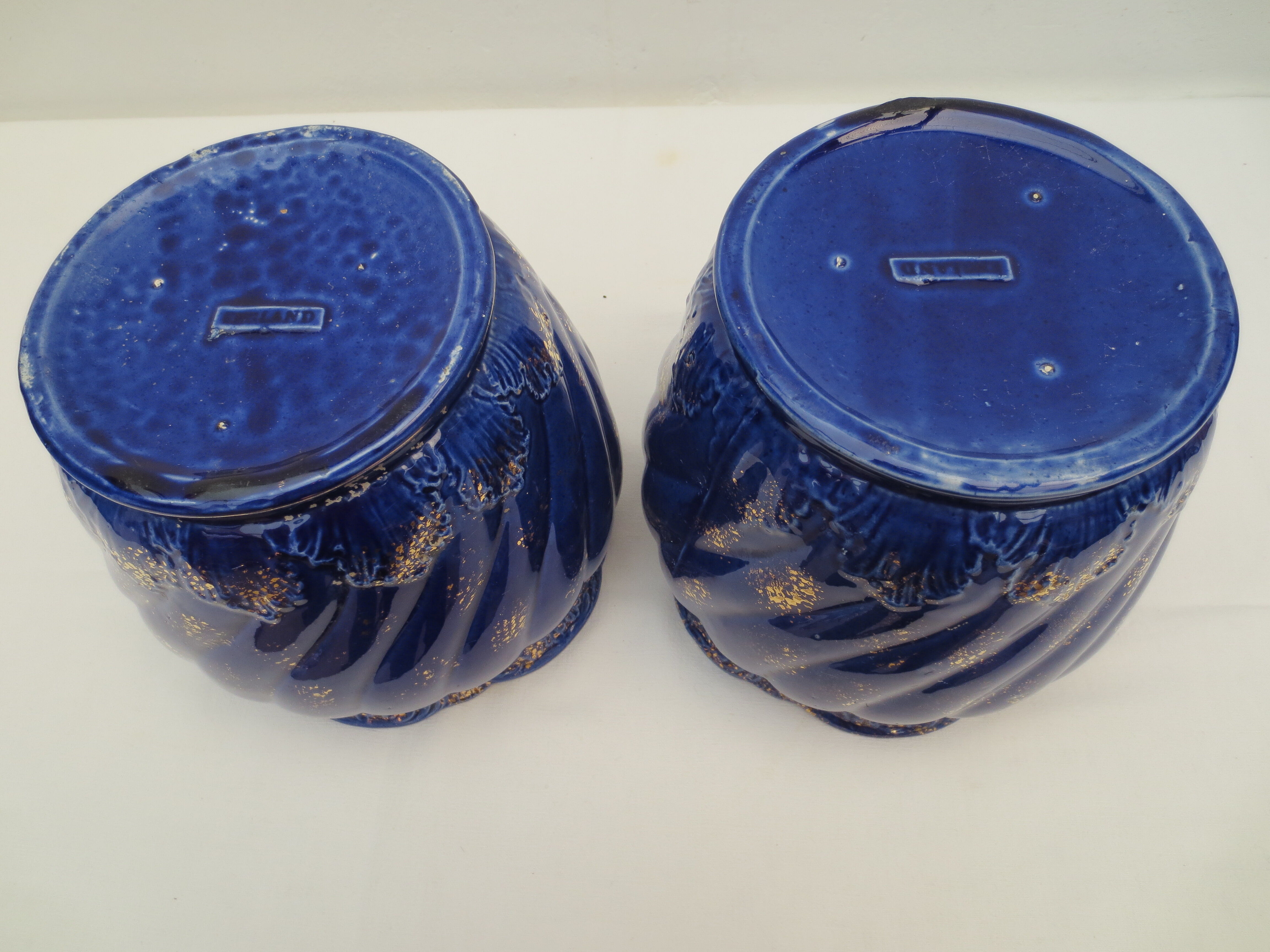 Pair of cache-old pots in midnight blue and gold ceramic