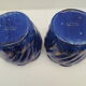 Pair of cache-old pots in midnight blue and gold ceramic