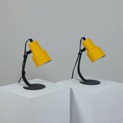 A pair of well-designed minimalist bedside lamps.