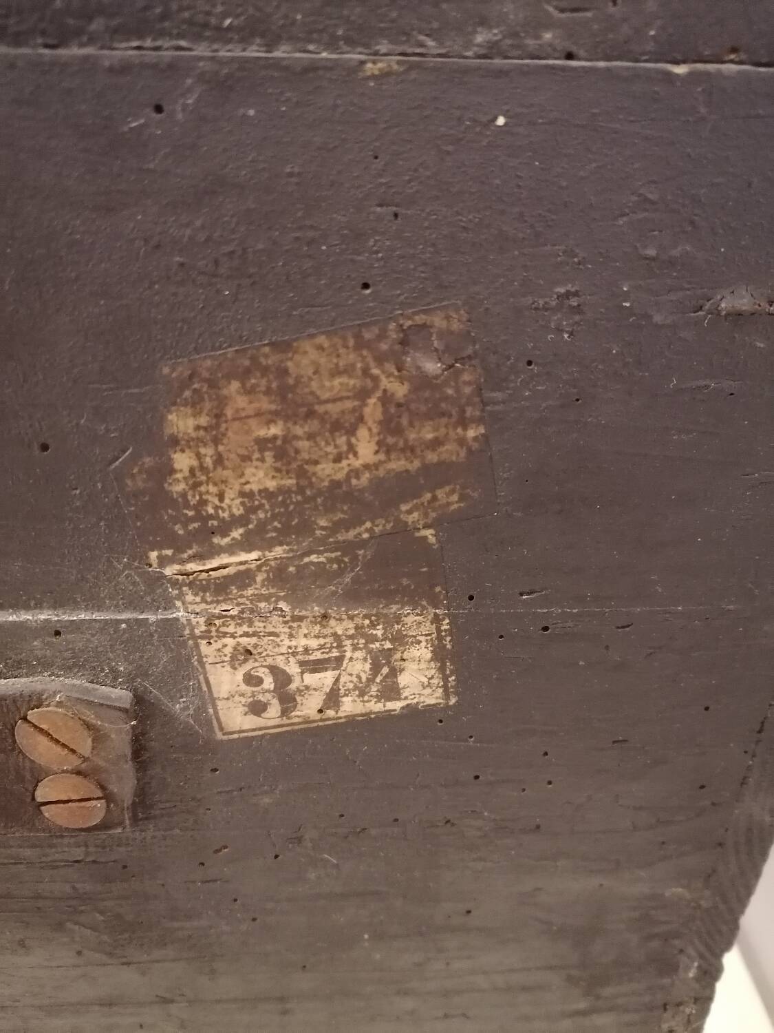 Large travel trunk in blackened wood