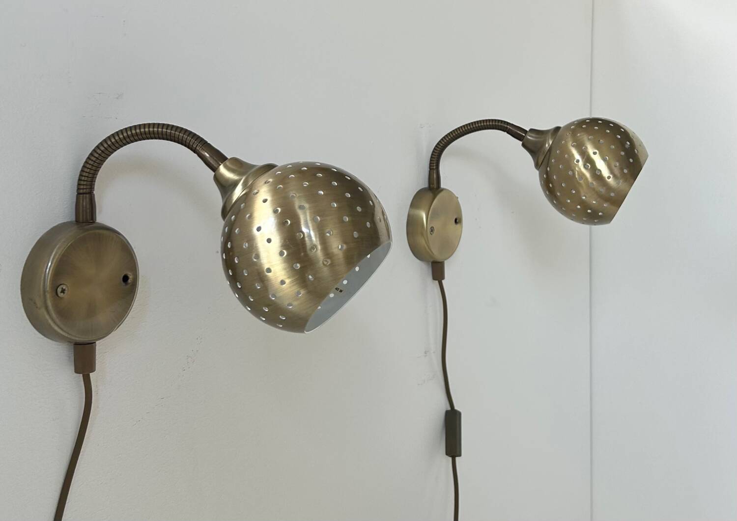 Pair of vintage adjustable wall lights, perforated brass, Sweden 1960