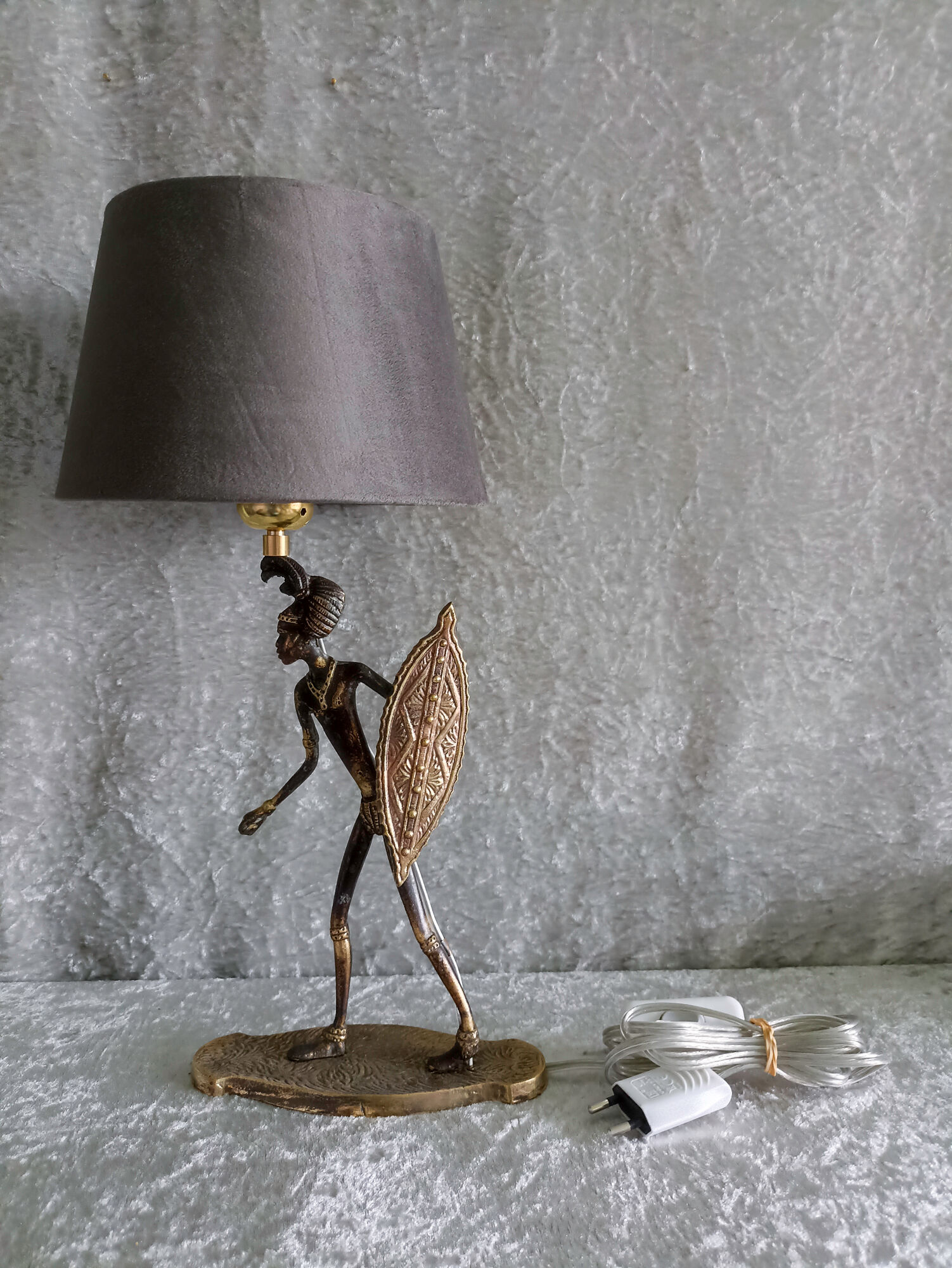 African warrior lamp in bronze.